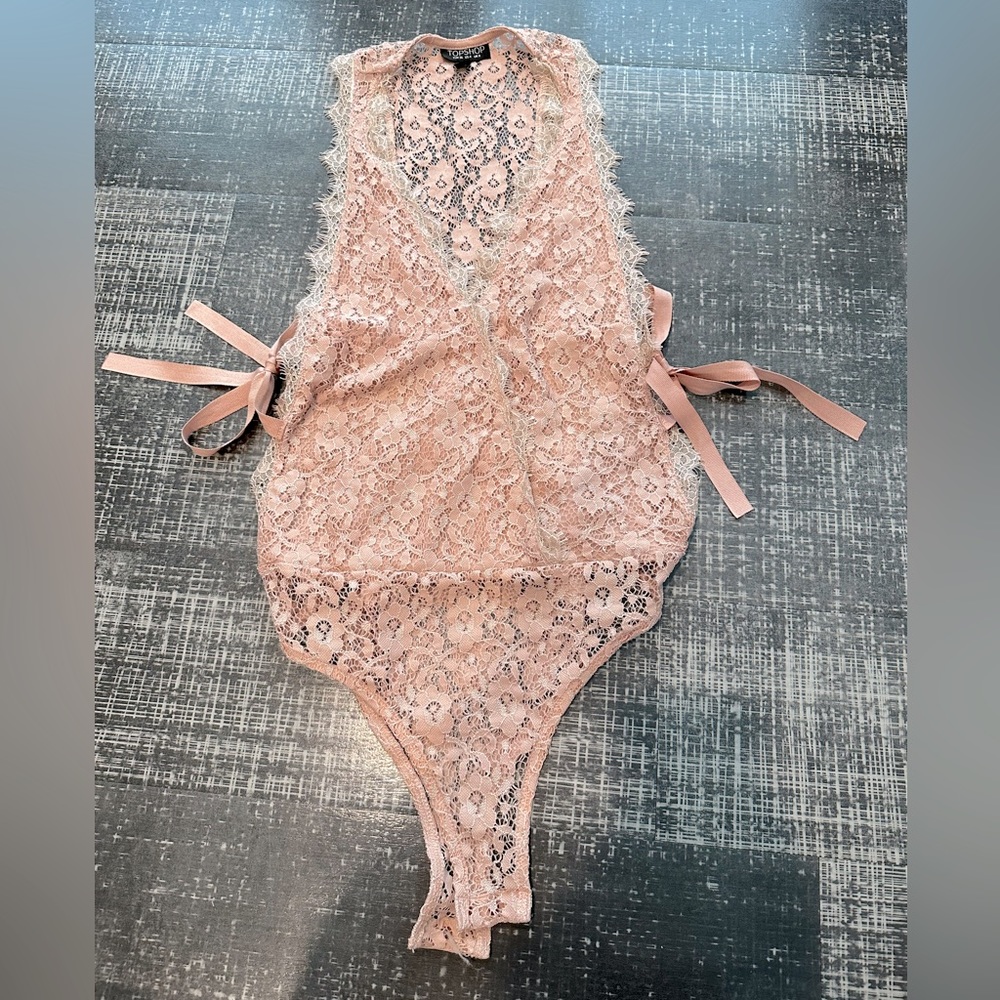 Lace side open pink body suit from Topshop, size 4